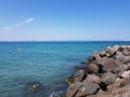 Pier of the town of Pomorie / Bulgaria, covered with breakwaters around, which protects the beach and the city from strong waves. Royalty Free Stock Photo
