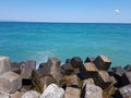 Pier of the town of Pomorie / Bulgaria, covered with breakwaters around, which protects the beach and the city from strong waves. Royalty Free Stock Photo