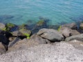 Pier of the town of Pomorie / Bulgaria, covered with breakwaters around, which protects the beach and the city from strong waves. Royalty Free Stock Photo