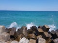 Pier of the town of Pomorie / Bulgaria, covered with breakwaters around, which protects the beach and the city from strong waves. Royalty Free Stock Photo