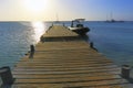 Pier on turquoise beach in Aruba at sunset, Caribbean Blue sea, Duth Antilles Royalty Free Stock Photo