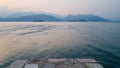 Pier at the waterfront of Stresa at sunset. Breathtaking views of Lago Maggiore, Piedmont, Italy.