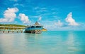 Pier with wooden shelter in sea in st johns, antigua Royalty Free Stock Photo