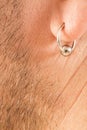 Pierced ear of a man Royalty Free Stock Photo