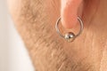 Pierced ear of a man Royalty Free Stock Photo