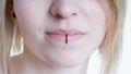 Pierced female lips with vertical labret piercing or lip ring Royalty Free Stock Photo