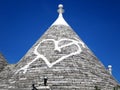 The "pierced heart" roof at the historical house "trullo" on Monte Pertica Street, Alberobello, ITALY