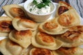 Pierogis with sour cream and fried onions