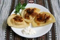Pierogis with sour cream and fried onions Royalty Free Stock Photo
