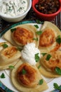 Pierogis with sour cream and fried onions Royalty Free Stock Photo