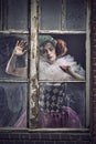 A pierrot woman behind the glass Royalty Free Stock Photo