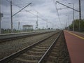 Pierzchno,Poland - May 20, 2023: photo of the station platform and railroad tracks from a perspective on a cloudy day