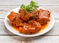 pig feet with red fermented beancurd served in dish isolated on wooden table top view hong kong food Royalty Free Stock Photo