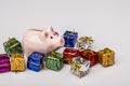 Pig money box between christmas gift Royalty Free Stock Photo