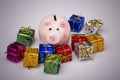 Pig money box between christmas gift Royalty Free Stock Photo