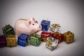 Pig money box between christmas gift Royalty Free Stock Photo