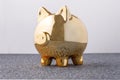 Pig money box golden on black background concept of financial insurance, protection, safe investment or banking