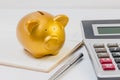 Pig piggy bank, calculator, notebook, pen, concept of saving money. Royalty Free Stock Photo