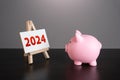 Pig piggy bank looking at 2024 year stand. Reflecting on past achievements and experiences. Embracing new trends, making forecasts
