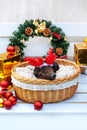 Pig piglet little black basket wicker cute Vietnamese breed new year happy Christmas tree horns deer decorations garland gift marb Royalty Free Stock Photo