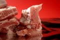 Pig, pork raw meat pieces over red Royalty Free Stock Photo