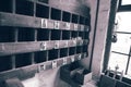 Pigeon hole box shelving on a wall in an old vintage workshop.