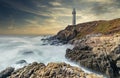 Pigeon Point Lighthouse against the backdrop of the beautiful sky and ocean with long exposure waves, a great landscape of the Royalty Free Stock Photo