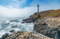 Pigeon Point lighthouse against the backdrop of a beautiful sky and ocean with waves, a great landscape of the Pacific coast in Royalty Free Stock Photo