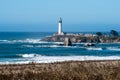 Pigeon Point Lighthouse, landscape view with brush and ocean waves in the foreground, on a clear sunny day on the California Coast Royalty Free Stock Photo