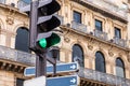 Pigeon on a traffic sign near a carefour