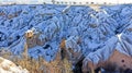 Pigeon valley with snowy landscape in winter in Cappadocia, Turkey Royalty Free Stock Photo