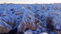 Pigeon valley with snowy landscape in winter in Cappadocia, Turkey Royalty Free Stock Photo