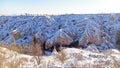 Pigeon valley with snowy landscape in winter in Cappadocia, Turkey Royalty Free Stock Photo