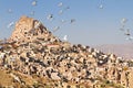 Pigeons over the rock formations in Uchisar, Cappadocia, Turkey Royalty Free Stock Photo