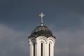 Pigeons resting and basking in sun on church copper roof