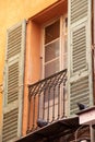 Pigeons sitting in a window of an old building in Nice, France