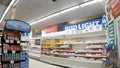 Piggly Wiggly grocery store bud light banner over poultry