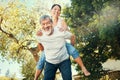 Piggy back, portrait and Asian couple in garden for bonding, healthy relationship and relaxing outdoors. Marriage Royalty Free Stock Photo