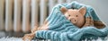 a piggy bank adorned with a winter hat and scarf, positioned next to a warm radiator in a cozy home interior, leaving