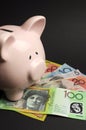 Piggy Bank with Australian money. Vertical. Royalty Free Stock Photo