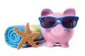 Piggy Bank on beach vacation, savings, travel money, retirement planning concept