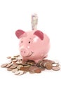 Piggy bank with British currency money Royalty Free Stock Photo