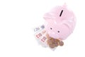 Piggy bank with cash money from above Royalty Free Stock Photo