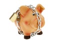 Piggy bank with a chain and lock secured Royalty Free Stock Photo