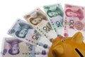 Piggy bank and Chinese money (RMB) Royalty Free Stock Photo