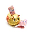 Piggy bank and Chinese yuan note isolated on white background Royalty Free Stock Photo