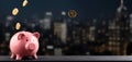 Piggy bank with coins and bank blurred building background dark themed wide banner with copy space area