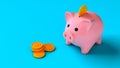 Piggy bank with coins on a blue background. Saving money. Coins fall into the piggy bank. 3d render Royalty Free Stock Photo