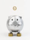 Piggy bank with coins isolated on a white background Royalty Free Stock Photo