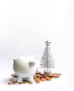 Piggy bank with coins. White ceramic moneybox Royalty Free Stock Photo